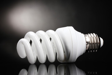 Energy saving lamp on black background