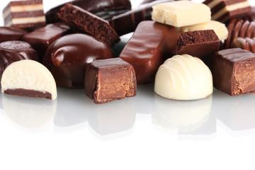 Many different chocolate candy isolated on white