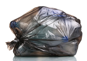 black garbage bag with trash isolated on white