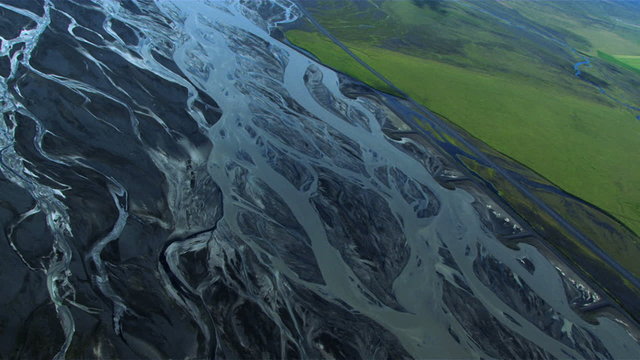 Aerial View of Glacial Meltwater Forming Arctic River Deltas