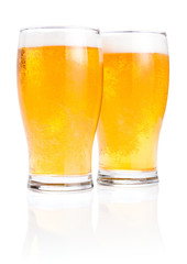 Two glasses fresh lager beer with foam Isolated on white backgro