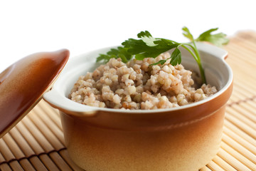 Nutritious porridge in the ceramic pot