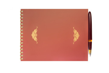 Spiral notebook and pen