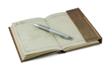 an old notebook and pen silver