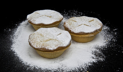 Christmas Mince Pies with stars sprinkled with icing sugar