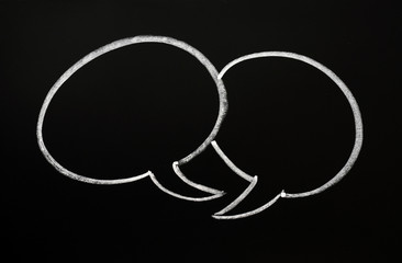 Two speech bubbles on a blackboard