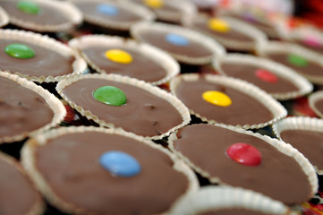 Chocolate cakes with colored candy