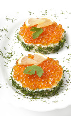 sandwiches with red caviar on white background