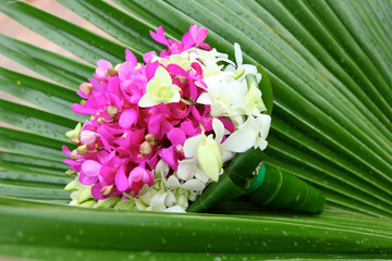 Wedding bouquet of pink and white orchids.