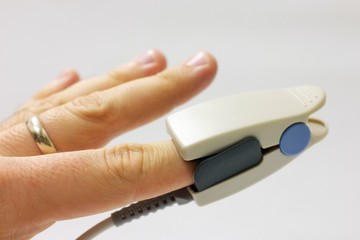 Fingertip SPO2 pulse oximeter sensor placed on index finger