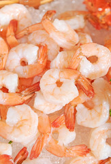 Shrimps close-up with salad on plate
