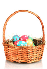 Colorful Easter eggs in the basket  isolated on white