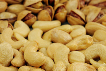 A macro of cashew nuts and Pistachio