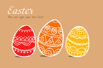 Three easter painted eggs on brown