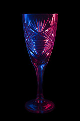 a wineglass of red and blue glow