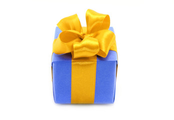 Present box with gold bow on a white background