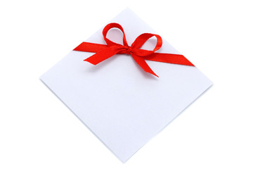 Piece of paper with red bow on a white background