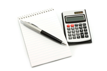 Notepad with ball pen and calculator on a white background