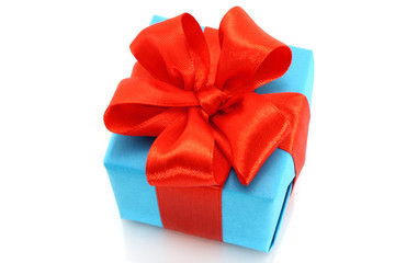 Present box with red bow on a white background