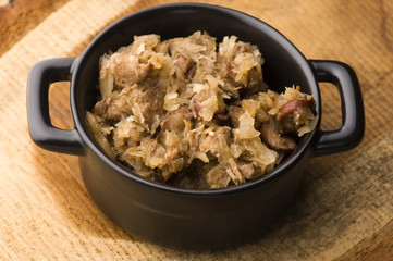 traditional polish sauerkraut (bigos) with mushrooms and plums f