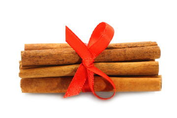 Bunch of cinnamon sticks with red bow