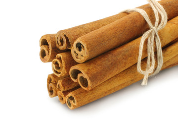 Bunch of cinnamon sticks on white background