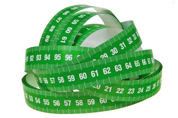 Green measurement tapes bundle isolated over white background.
