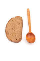 Wooden spoon and a slice of bread