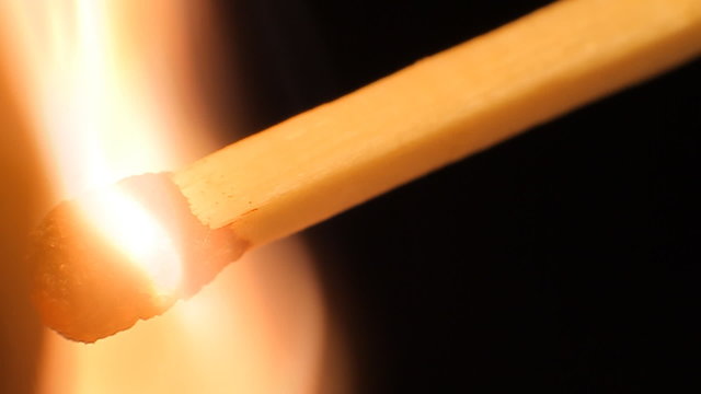 Flame of match ignites and then blown out.Close-up filming