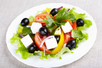 Greek salad on white plate