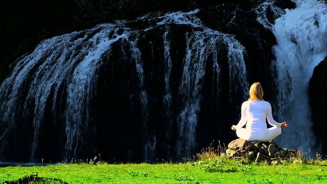 Female Practising Yoga by Waterfall