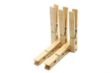 Five clothespins close-up on a white background