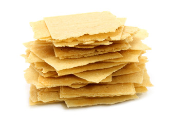 Heap of potato chips on a white background