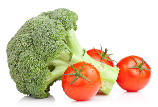 Broccoli and Three Tomato with drops Isolated on white backgroun