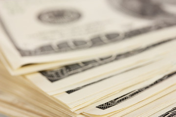 A lot of one hundred dollar bills closeup