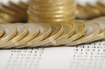 Close up of the golden coin stacks on background with numbers