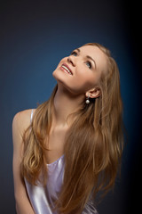 Fototapeta premium Beauty woman studio portrait look at light