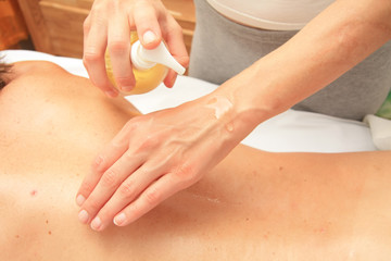 Woman preparing hands with oil