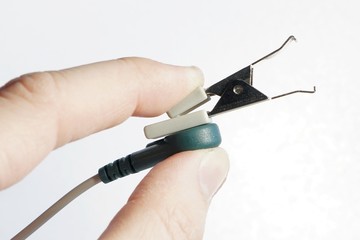 Veterinary ECG crocodile electrode held in left hand