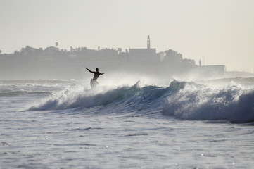 Surfer riding a wave - 37869560
