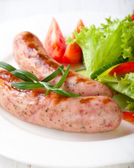 Grilled white sausage (Weisswurst) with vegetables