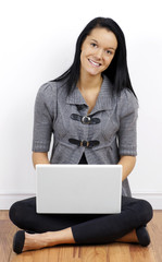 Cute young woman with laptop