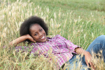 Woman relaxing laid in field