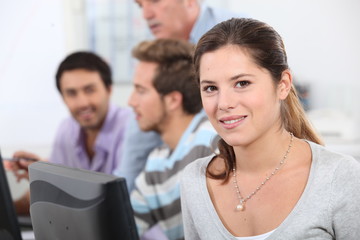 Brunette student sat next to class mates