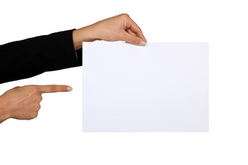 Businesswoman pointing at a blank piece of paper