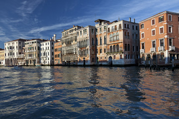 late afternoon sum shining on grand canal buildings, venice