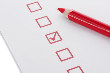 Checklist and red pencil closeup