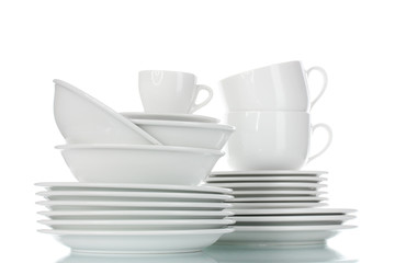 empty bowls, plates and cups isolated on white