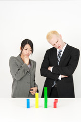 business team looking building block