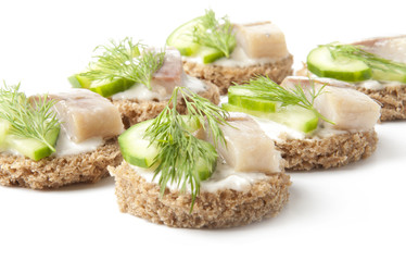 sandwiches with herring, cucumber and dill